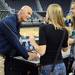 Michigan women's basketball coach Kevin Borseth chats with fans as he signs autographs during an open house at Crisler Arena on Friday evening. Melanie Maxwell I AnnArbor.com